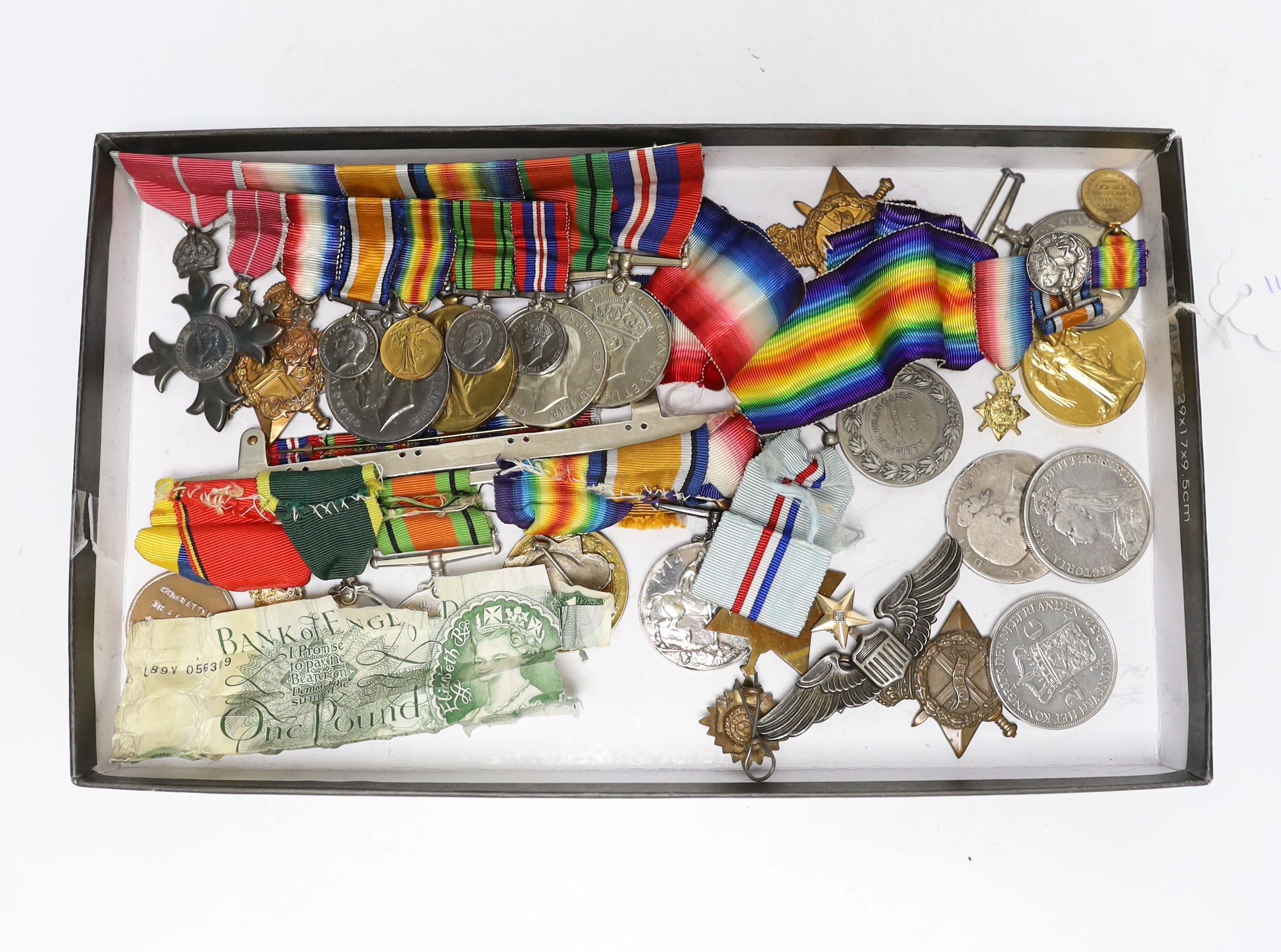 A collection of eighteen medals and some associated miniatures; a WWI/WWII group including a military MBE, WWI trio, WWII Defence and War medals to J.I.B. Farrant R.N. together with its miniature group and bar